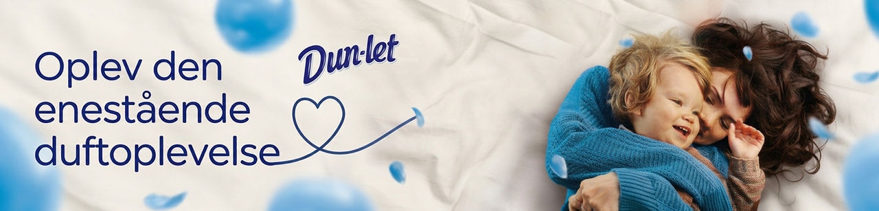Dun-let banner med mor og barn der ligger i blødt sengetøj og teksten Oplev den enestående duftoplevelse